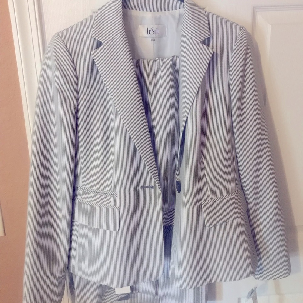 Two piece pinstriped black and white women’s suit.